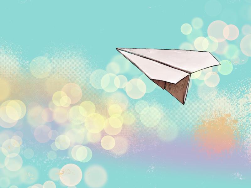 Paper airplane flying through the sky