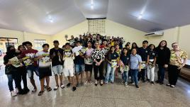 Josi posing with students. 